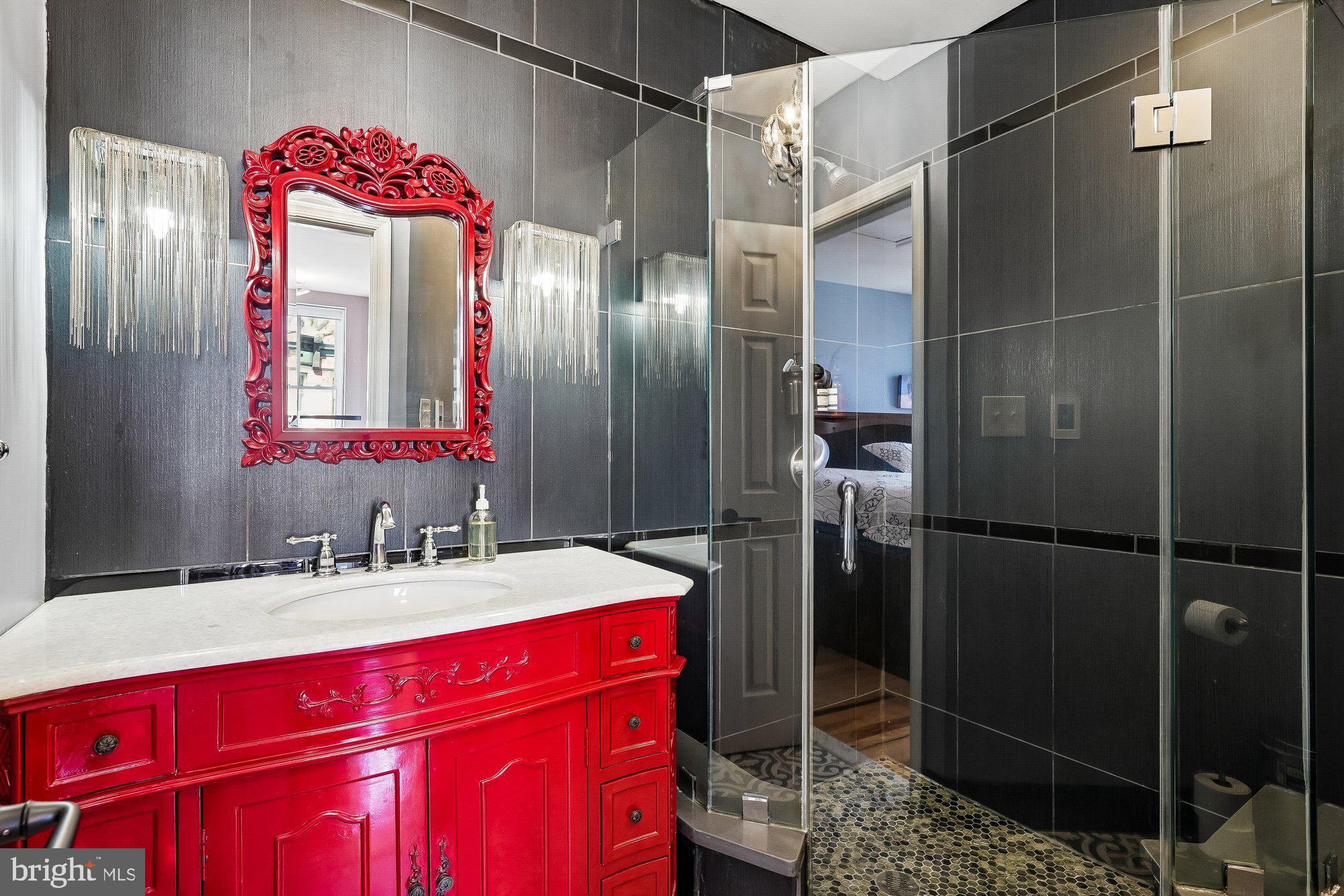 909 C Street Northeast Washington, DC 20002 - Photo 22 of 43 a bathroom with a sink vanity and a mirror