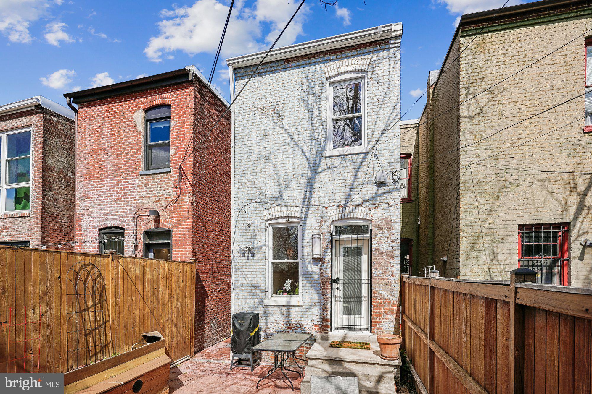 909 C Street Northeast Washington, DC 20002 - Photo 40 of 43 a view of a brick house with large windows