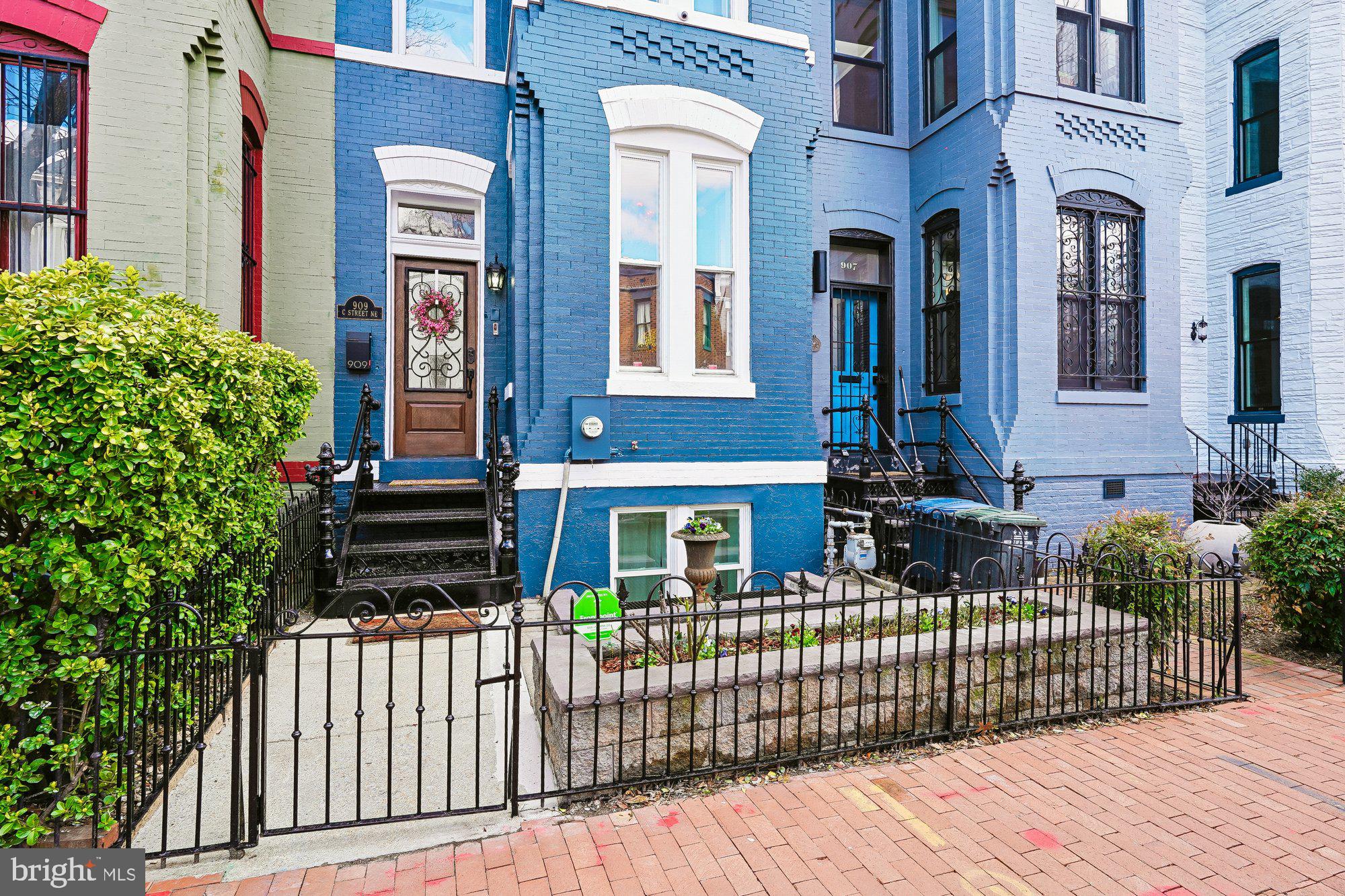 909 C Street Northeast Washington, DC 20002 - Photo 4 of 43 a front view of a house with a porch
