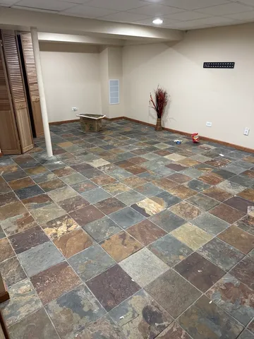 a view of a room with wooden floor