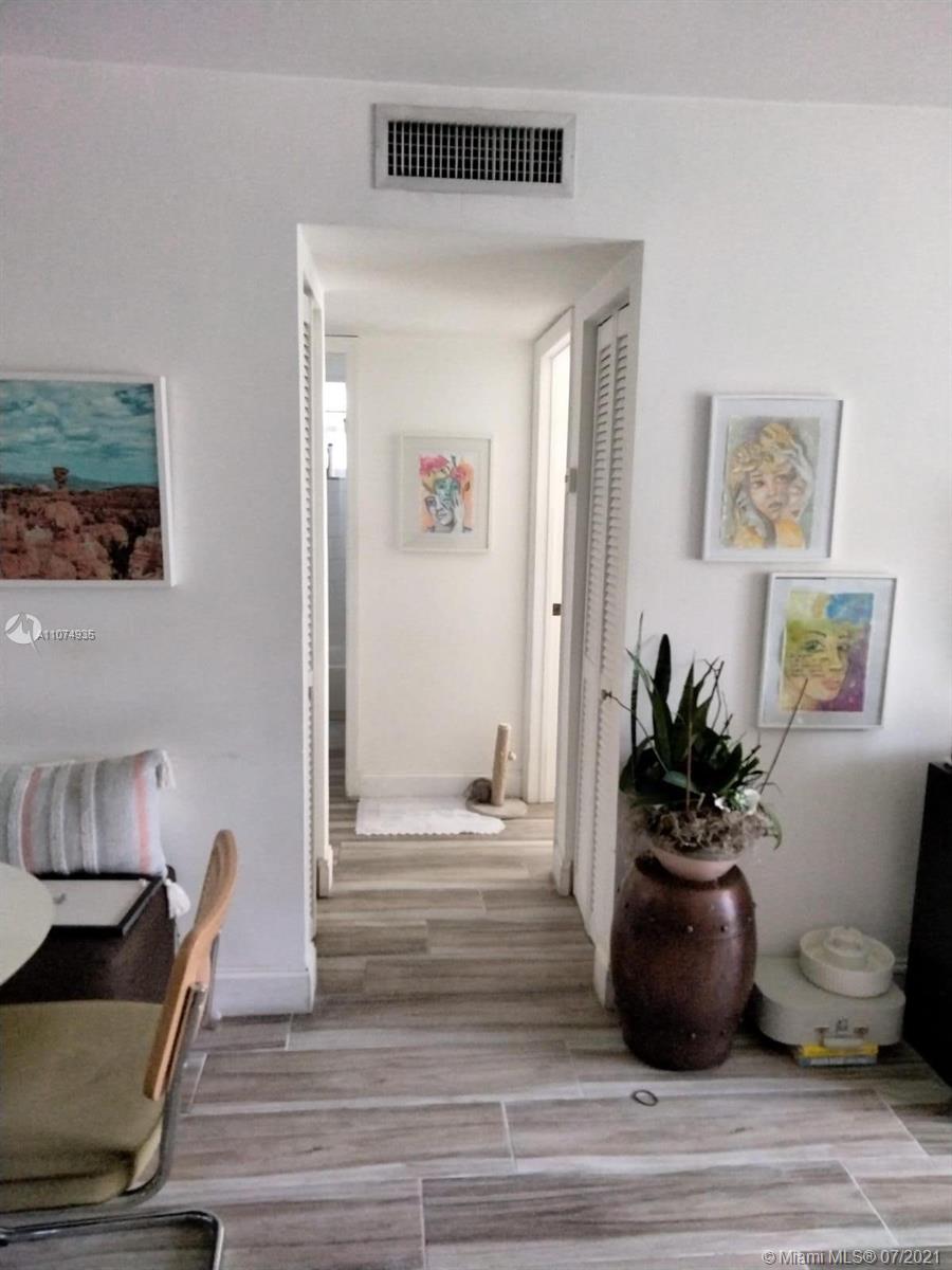 665 Northeast 83rd Terrace, Unit 314 Miami, FL 33138 - Photo 4 of 10 a view of a living room and a potted plant