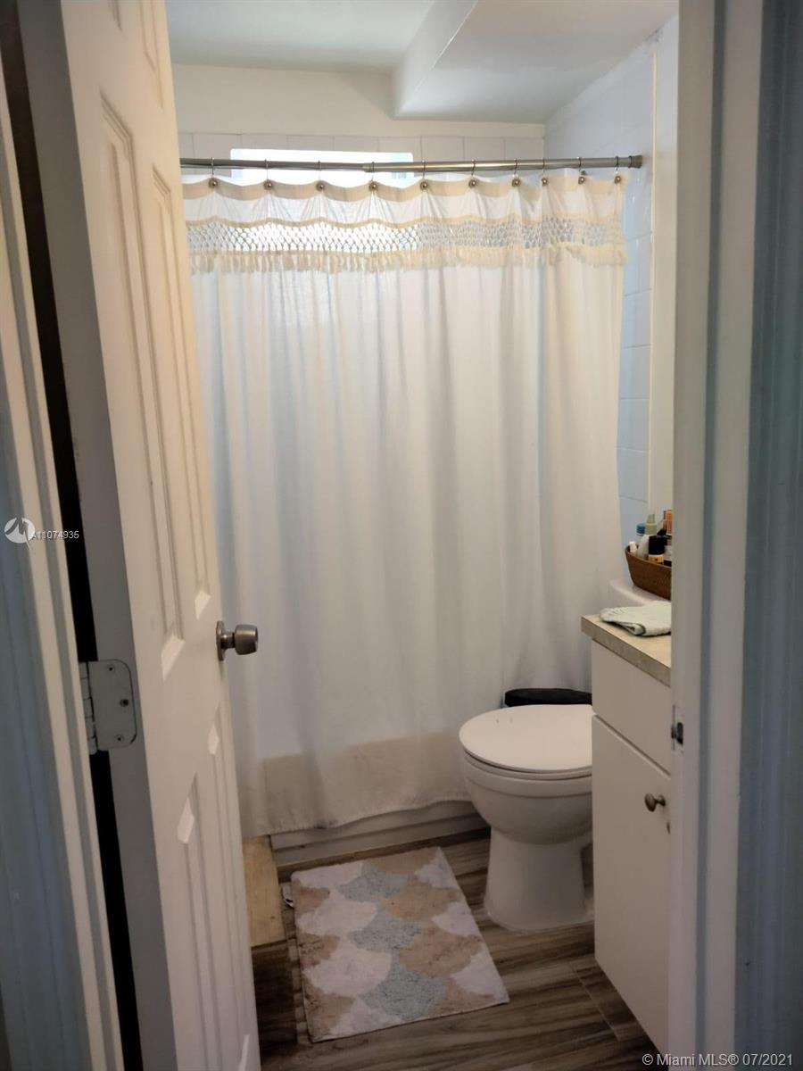 665 Northeast 83rd Terrace, Unit 314 Miami, FL 33138 - Photo 10 of 10 a bathroom with a sink toilet and shower