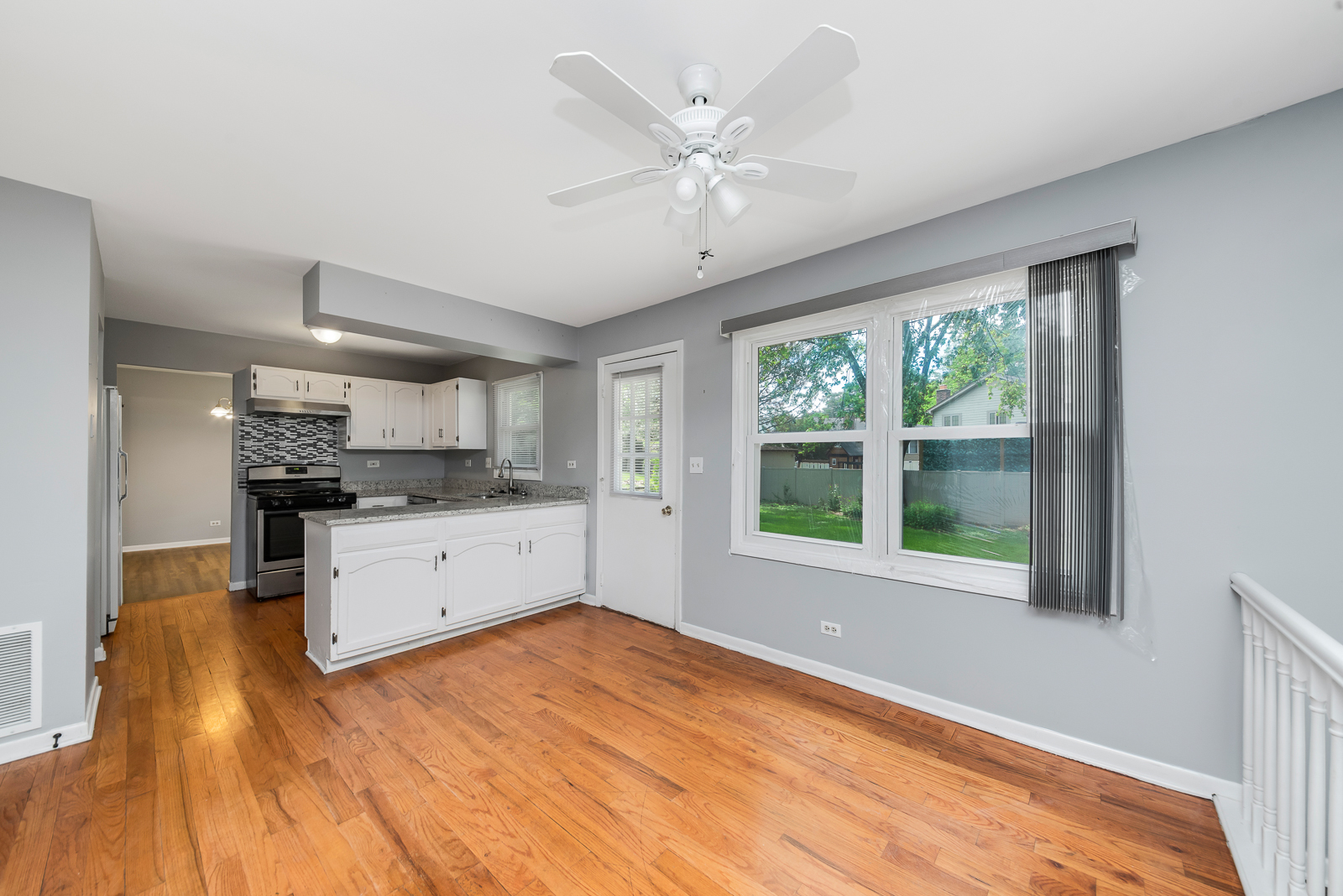 1441 Concord Drive Downers Grove, IL 60516 - Photo 2 of 16 a large white kitchen with a large window