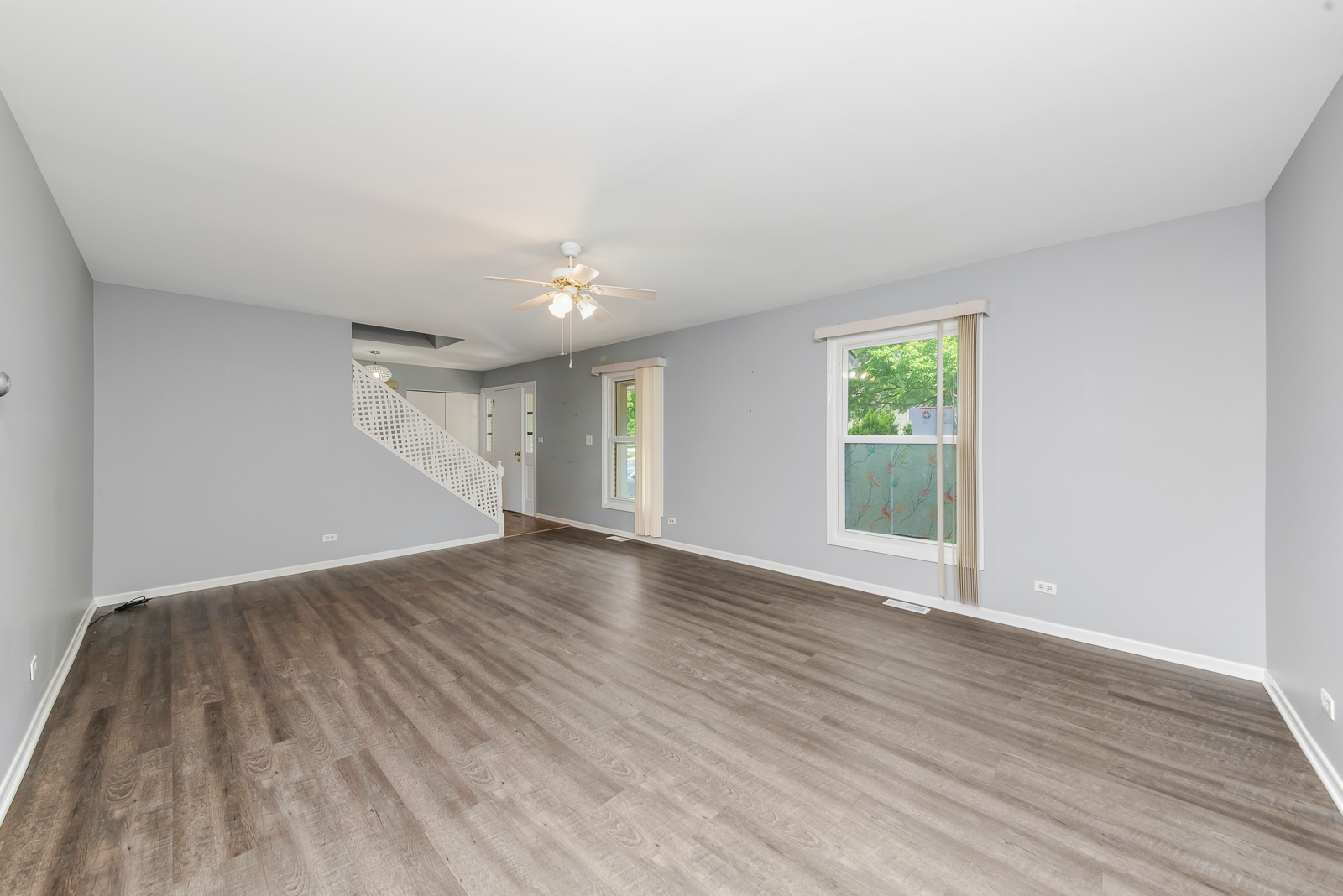 1441 Concord Drive Downers Grove, IL 60516 - Photo 5 of 16 a view of an empty room with wooden floor and a window