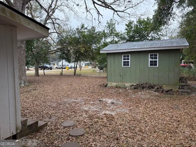 a backyard of a house with lots of green space