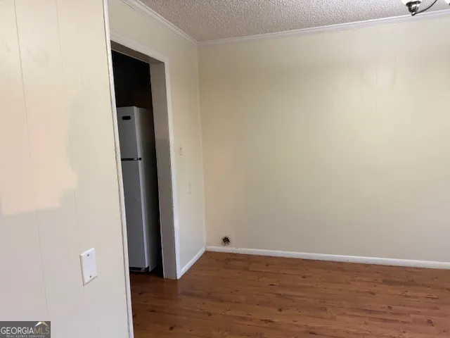 a view of a small space with wooden floor