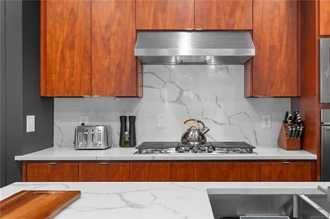 a very nice looking living room with furniture and a large window