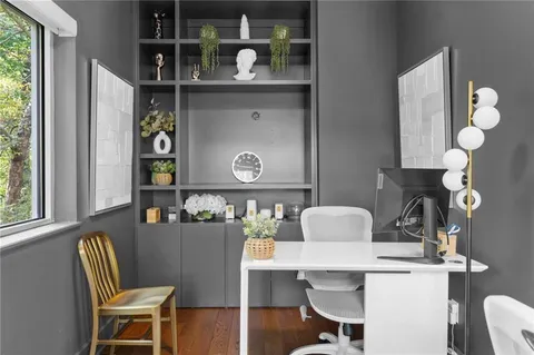 a view of a patio with a table and chairs
