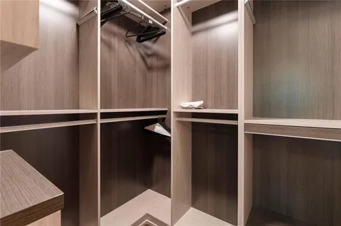 a bathroom with double vanity sinks and a mirror