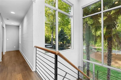 a living room with furniture ceiling fan and a wooden floor
