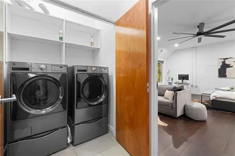 a view of a balcony with two chairs and a table
