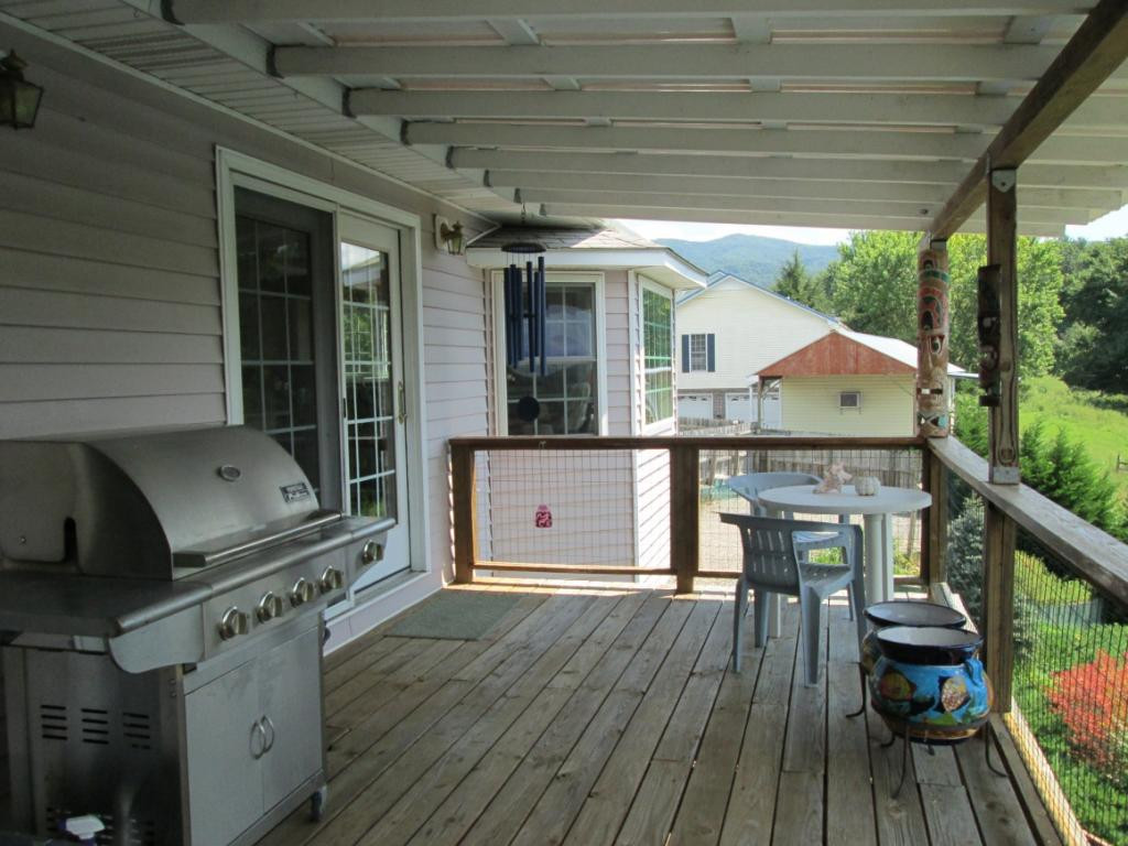 1120 Reece Hill Road Mountain City, TN 37683 - Photo 10 of 36 Covered Deck from dining room