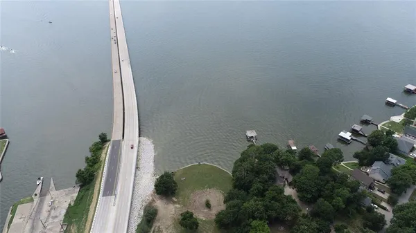 a vase of flowers sitting on a floor