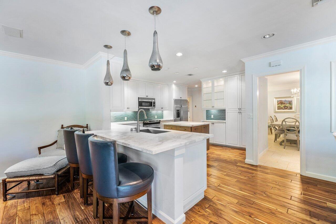 2377 East Silver Palm Road Boca Raton, FL 33432 - Photo 19 of 40 a view of kitchen and dining area with furniture