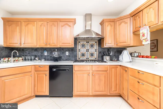 a spacious bathroom with a granite countertop sink and a large mirror