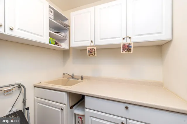 a view of a livingroom with a furniture workspace and a window