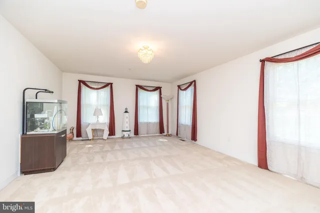a bathroom with a granite countertop bathtub and a shower