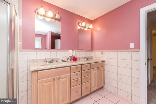 a spacious bedroom with a bed and furniture