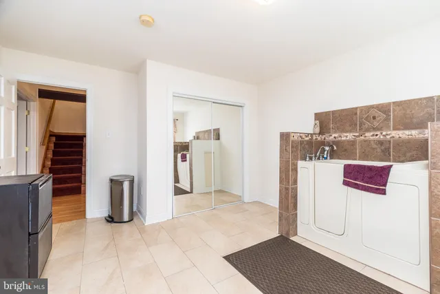 a view of a livingroom with furniture and a flat screen tv