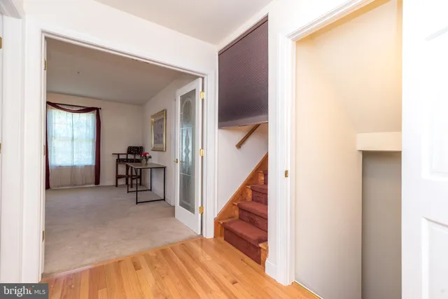 a white bath tub sitting in a bathroom next to a window