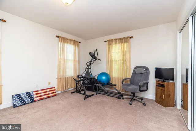 a kitchen with stainless steel appliances granite countertop a refrigerator and a stove