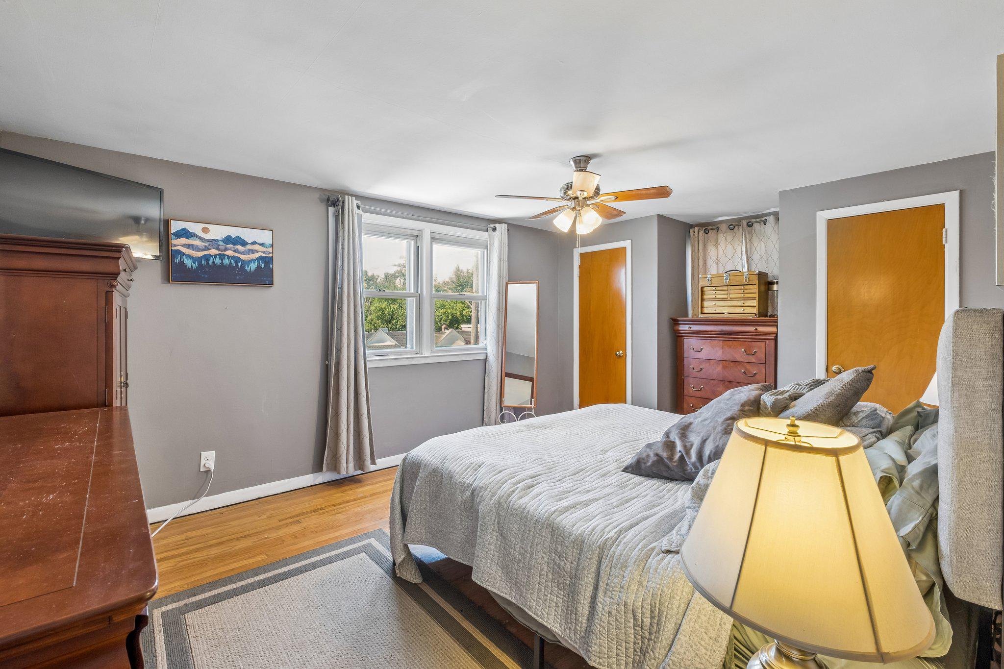 725 Hill Road Philadelphia, PA 19128 - Photo 17 of 43 a bedroom with a bed and wooden floor