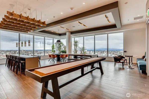 a living room with furniture and painting on the wall