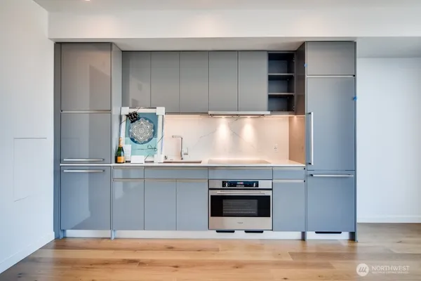 a kitchen with a stove and a microwave