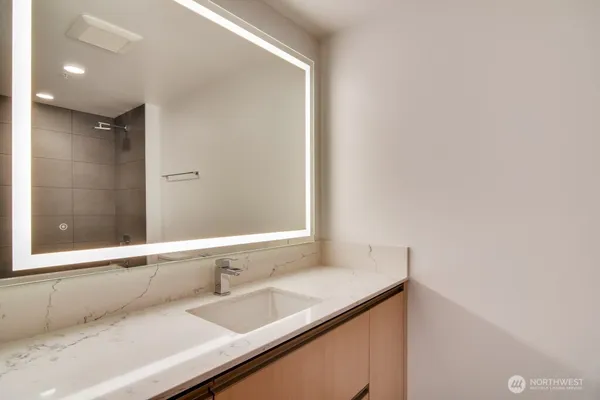 a bathroom with a sink and a mirror