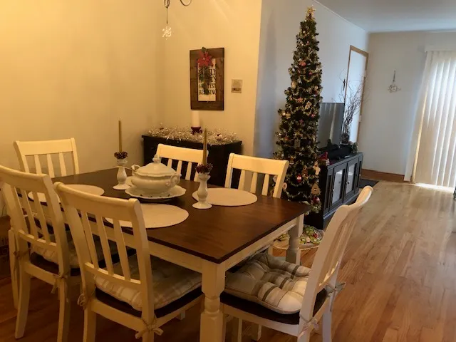 a view of a dining room with furniture and window