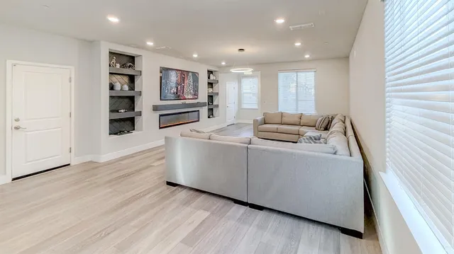 a living room with furniture and a large window