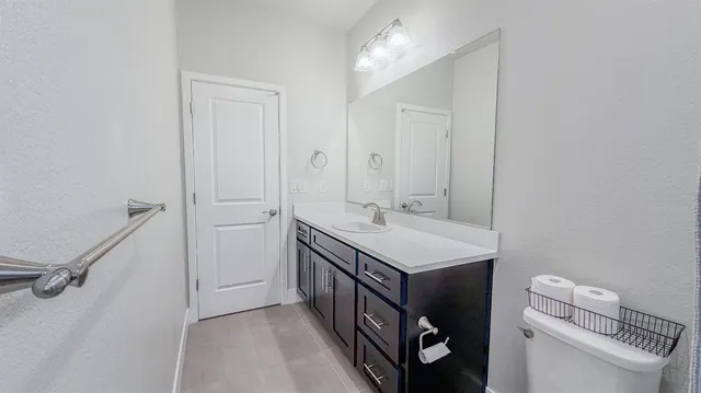 a bedroom with a bed and a cabinets