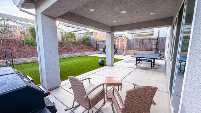 a view of a house with a yard porch and sitting area