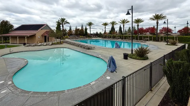 a view of an outdoor space with floor to ceiling window