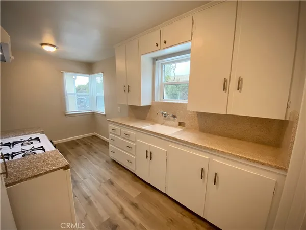 a bathroom with a sink and a window