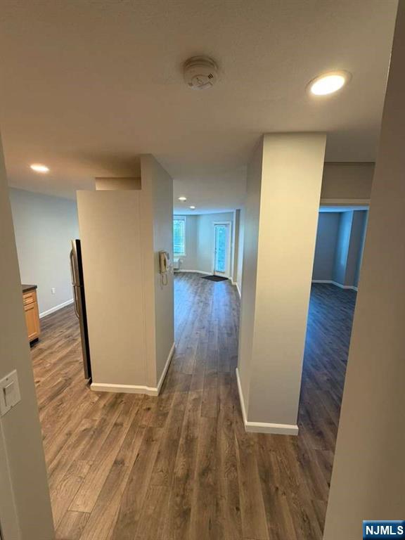 115 Polifly Road, Unit 5D Hackensack, NJ 07601 - Photo 3 of 10 a view of a hallway with wooden floor