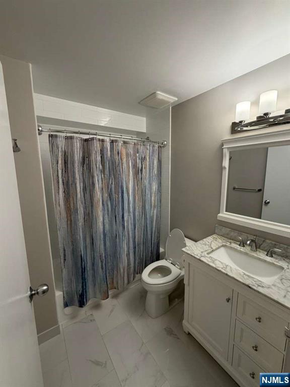 115 Polifly Road, Unit 5D Hackensack, NJ 07601 - Photo 10 of 10 a bathroom with a sink toilet and shower