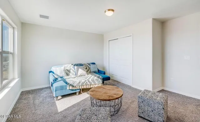 a living room with furniture and a window
