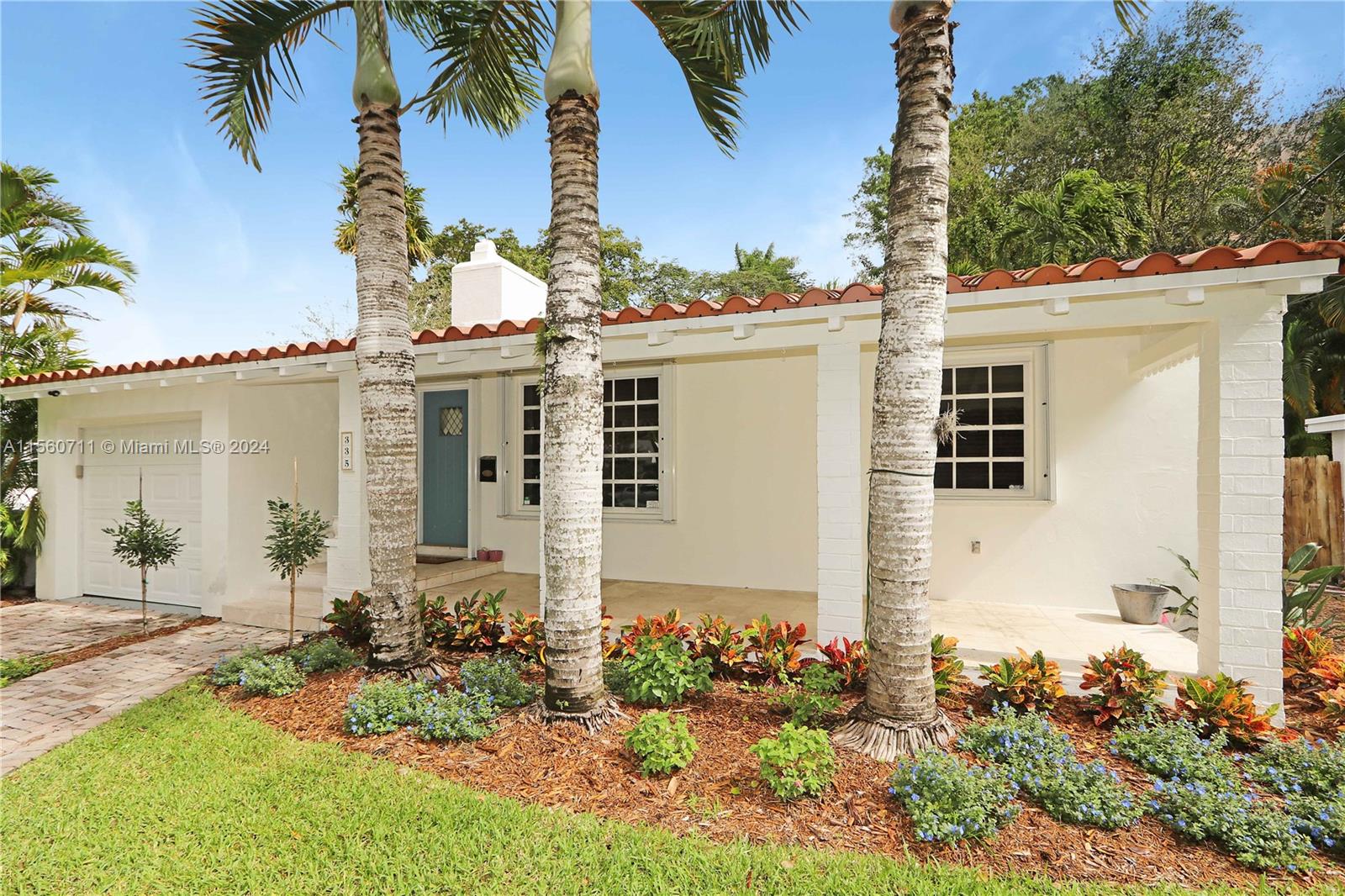 335 Southwest 31st Road Miami, FL 33129 - Photo 1 of 20 front view of a house with a yard