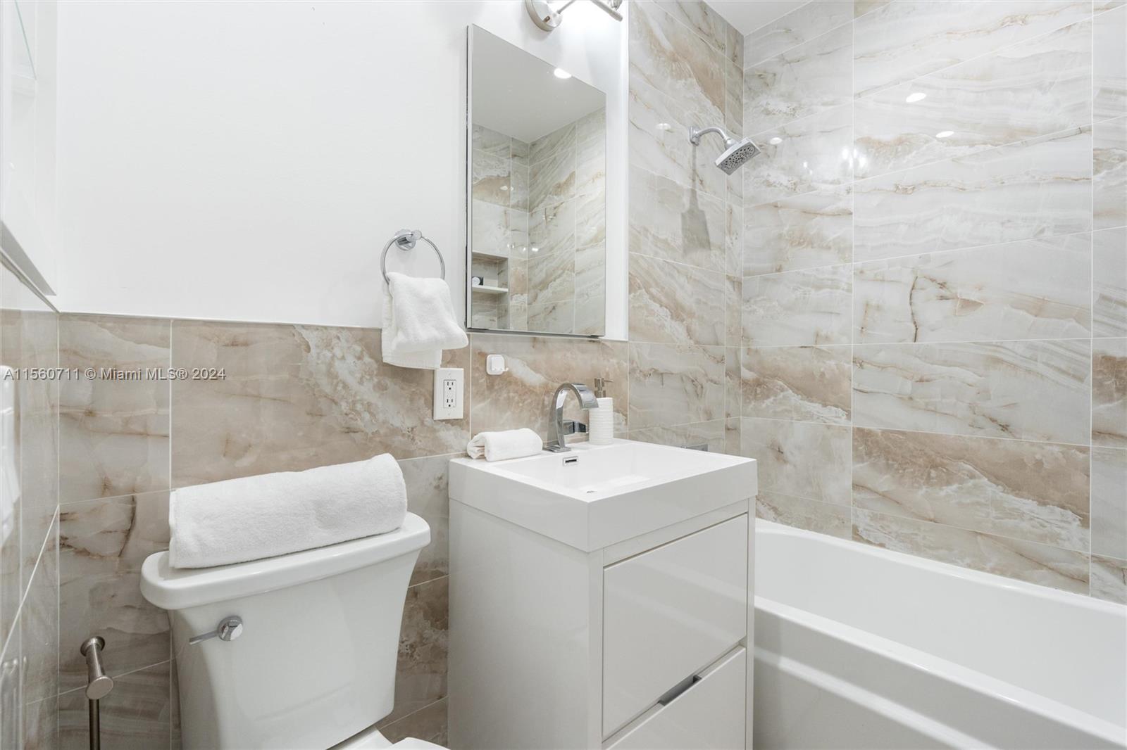 335 Southwest 31st Road Miami, FL 33129 - Photo 18 of 20 a bathroom with a sink toilet and shower