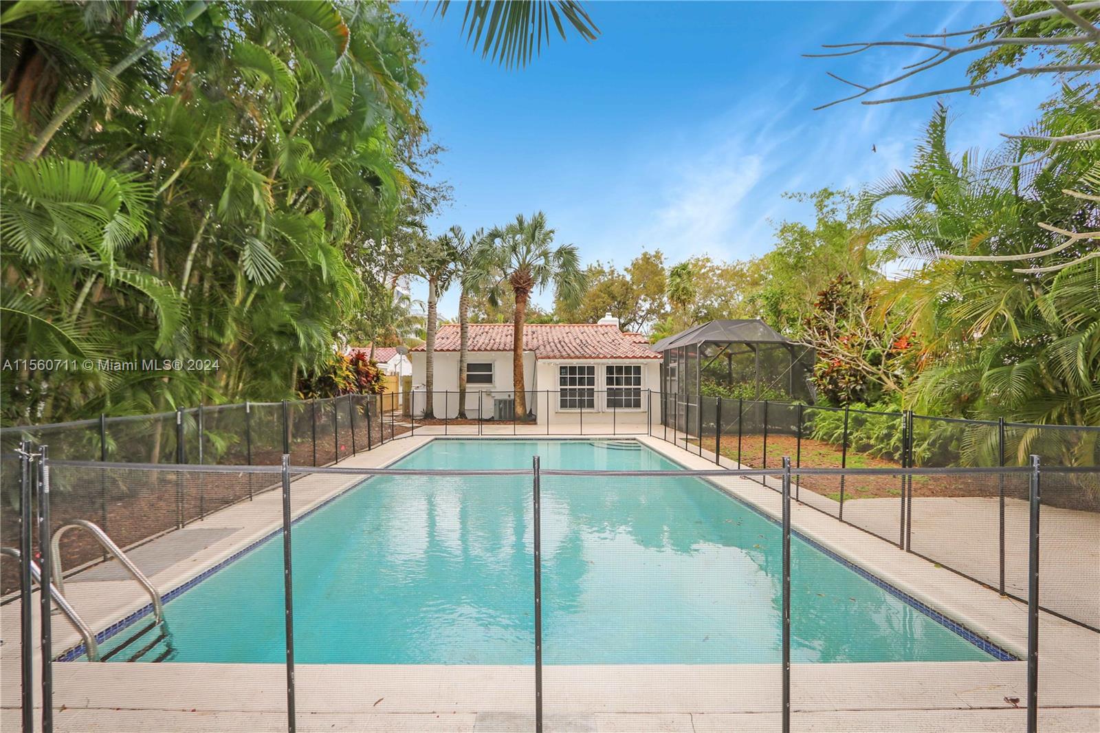 335 Southwest 31st Road Miami, FL 33129 - Photo 2 of 20 a view of a swimming pool with a balcony