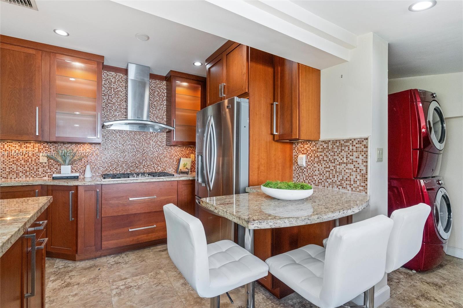 335 Southwest 31st Road Miami, FL 33129 - Photo 9 of 20 a kitchen with stainless steel appliances granite countertop a sink and a refrigerator