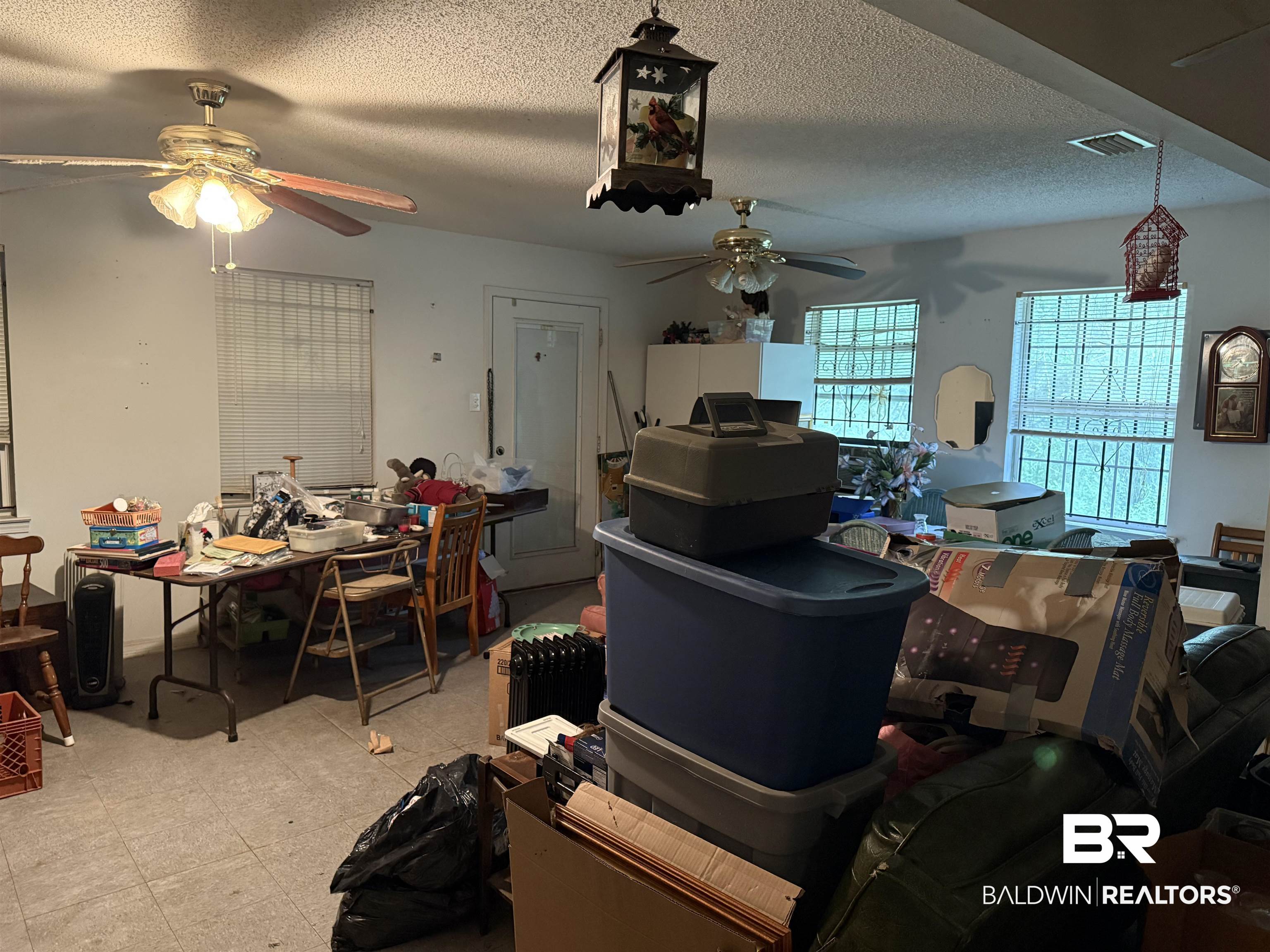 157 North Shelton Beach Road Eight Mile, AL 36613 - Photo 5 of 5 Dining space featuring light floors, visible vents, a textured ceiling, and ceiling fan