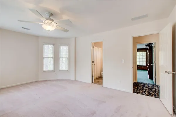 a spacious bathroom with a tub shower and sink
