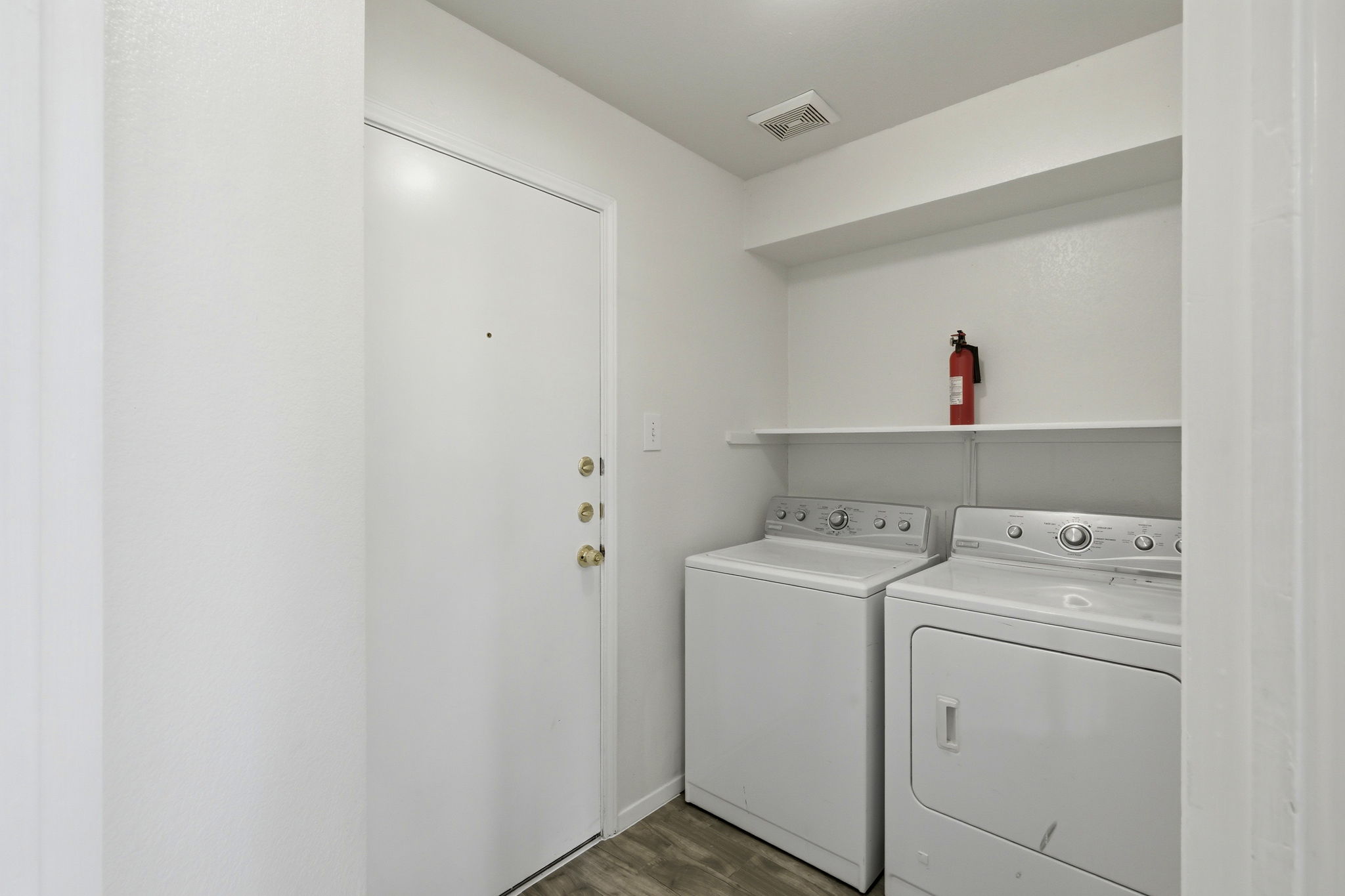 1005 Rolling Ridge Drive Round Rock, TX 78665 - Photo 13 of 18 Conveniently located laundry area with ample shelving and efficient appliances.