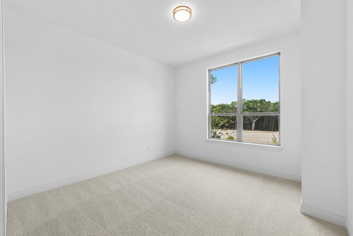 4608 Destination Way Jonestown, TX 78645 - Photo 17 of 29 a view of an empty room with a window