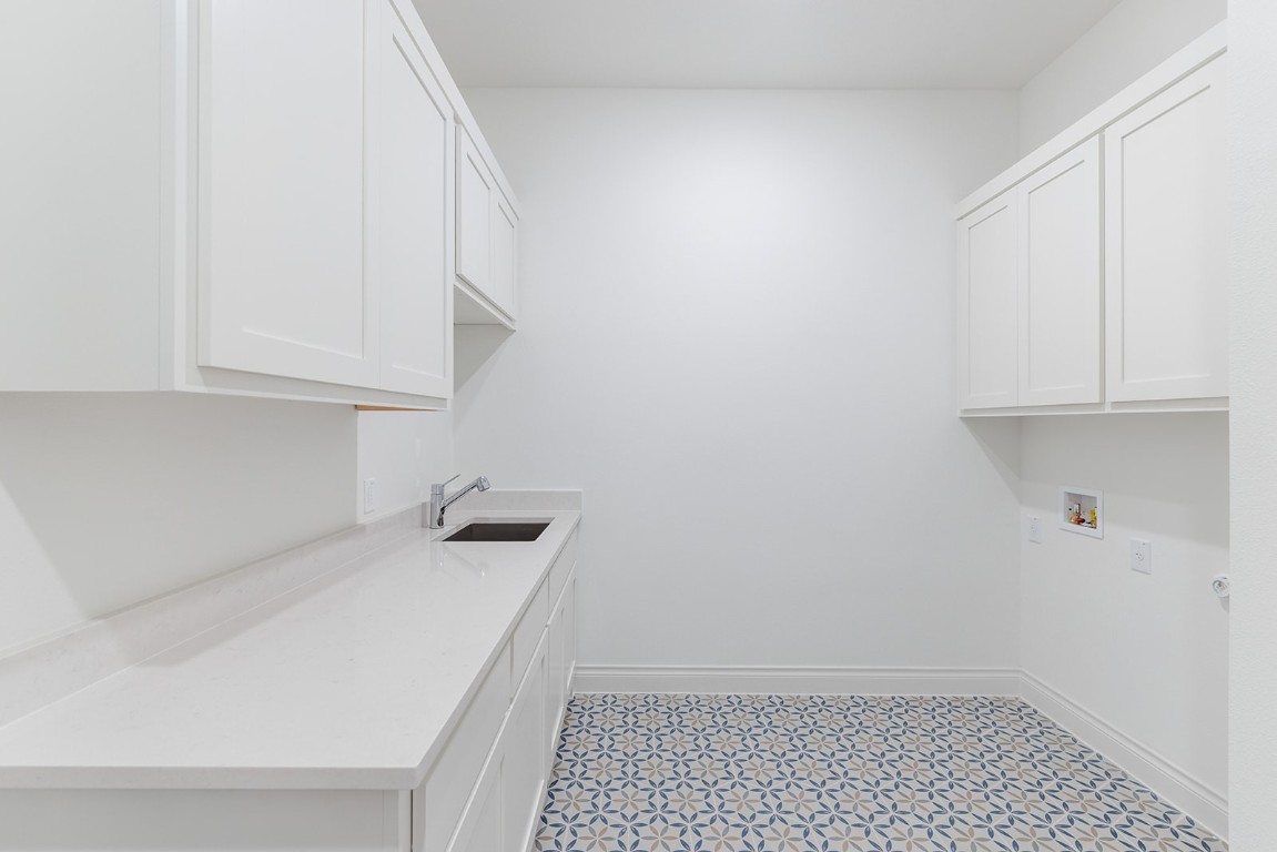 4608 Destination Way Jonestown, TX 78645 - Photo 25 of 29 a room with a sink and cabinets