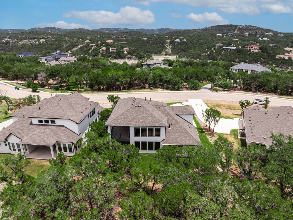 4608 Destination Way Jonestown, TX 78645 - Photo 28 of 29 an aerial view of multiple houses with a yard