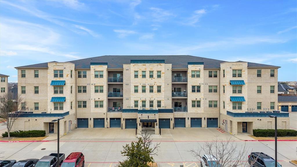 651 Watters Road, Unit 5205 Allen, TX 75013 - Photo 2 of 31 a front view of a building with glass windows