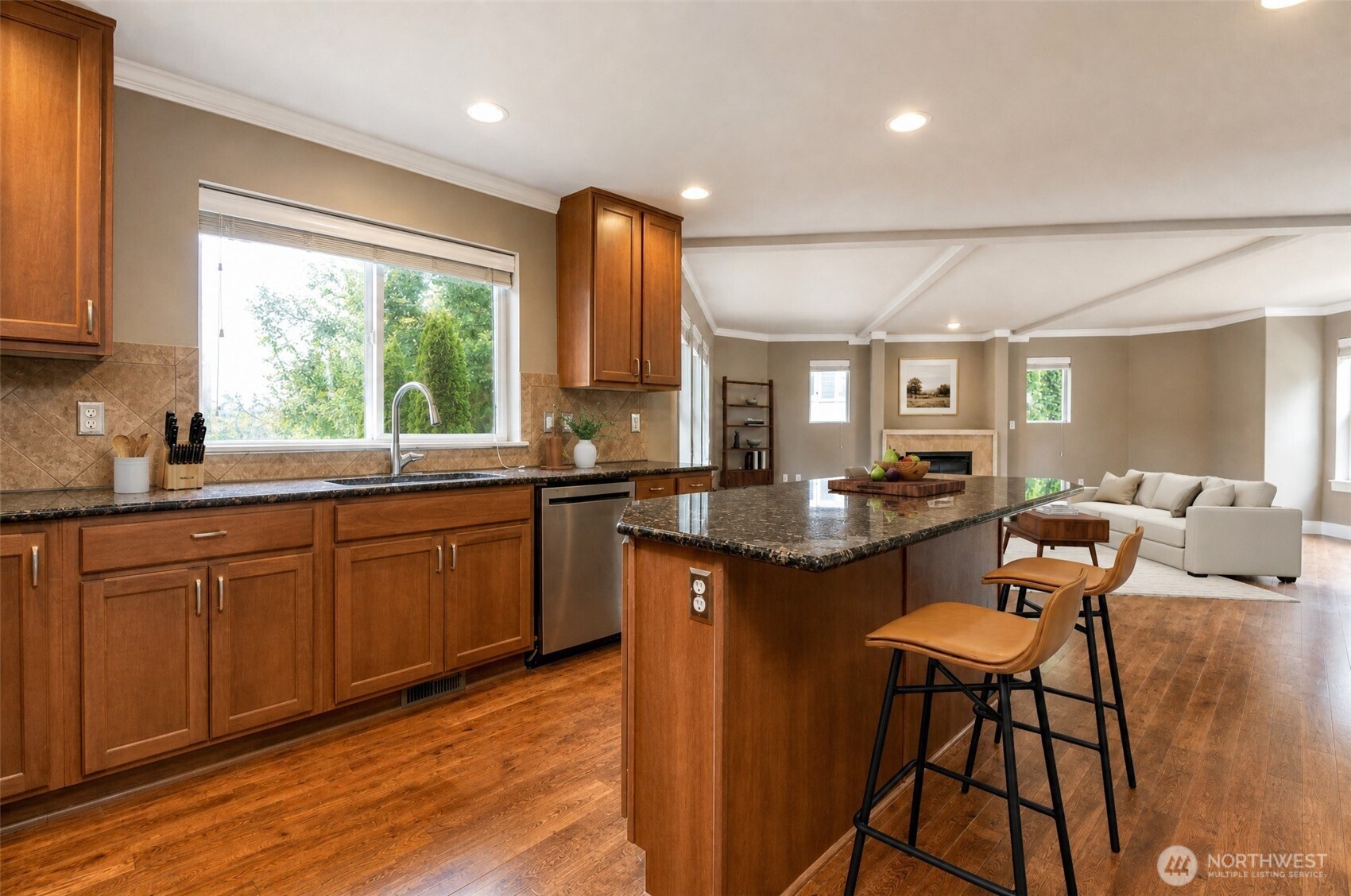 3000 South Mt Baker Boulevard Seattle, WA 98144 - Photo 13 of 40 a kitchen with stainless steel appliances granite countertop wooden cabinets a sink a stove a dining table and chairs